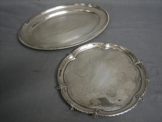A Victorian circular engraved silver plated salver and an oval silver plated meat plate by Elkingtons