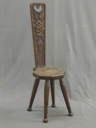 A carved oak spinning chair