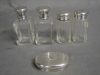 2 square cut glass dressing table jars with silver lids, 2 circular pin jars with silver lids, an oval engraved silver lid London 1918