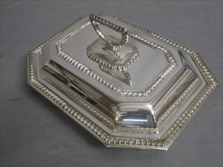 A lozenge shaped silver plated entree dish and cover