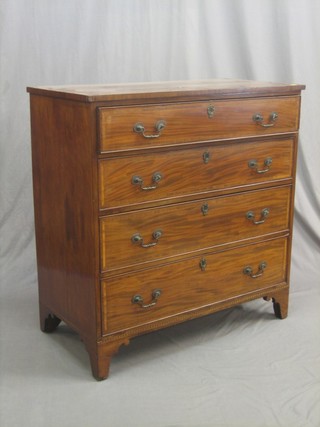 A  Georgian mahogany chest with rosewood and crossbanded top, fitted 4 long drawers and with brass swan neck drop handles, raised on bracket feet 40"