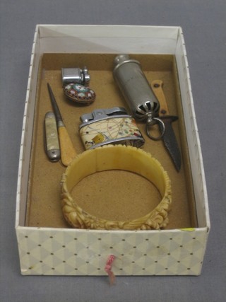 The Hudson patent whistle, a miniature Bowie knife, a miniature lighter, a Rolstar lighter, a micro mosaic brooch, a carved ivory bangle, a bodkin and a small pocket knife