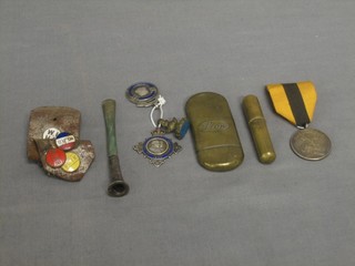 A Securicor silver medal, 2 silver watch chain medallions, 6 enamel badges, a cigarette holder, a gilt metal seal and 2 lighters