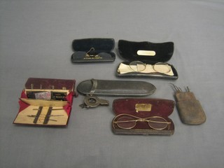 A Victorian silver and leather spectacle case folder and various gilt metal and other spectacle frames