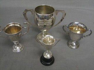 4 various silver plated twin handled trophy cups