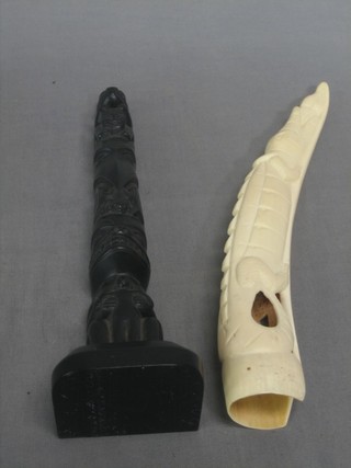 A section of ivory carved a crocodile 12" and a figure in the form of a totem pole