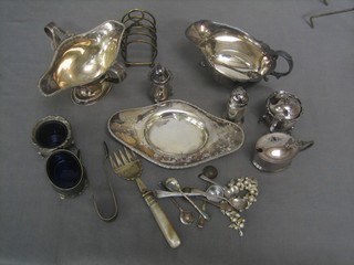 A silver plated double spouted sauce boat, a silver plated sauce boat, a condiment set etc