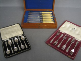 A walnut cased  canteen of 6 silver plated fish knives and forks, a set of 6 silver plated pastry forks by Garrards and a set of 6 silver plated teaspoons, all cased