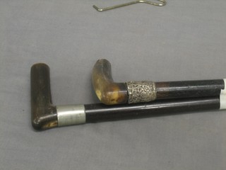 2 ebony walking sticks with horn handles