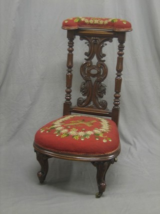 A Victorian mahogany show frame Pre Dieu chair upholstered in Berlin woolwork material