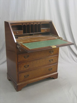 A Queen Anne style walnut bureau with fall front above 3 long graduated drawers, raised on bracket feet 30"