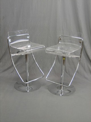 A pair of chrome and perspex "Designer" adjustable stools