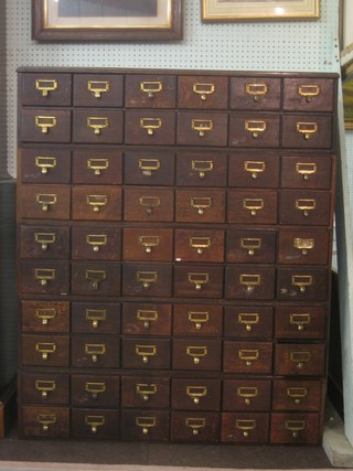 An oak card index filing chest of 60 drawers 40"