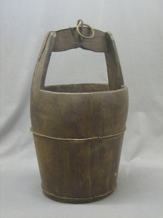 A reproduction wooden well bucket