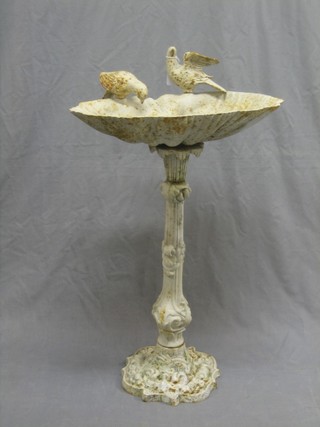 A Victorian style iron scallop shaped bird bath decorated 2 birds 19"
