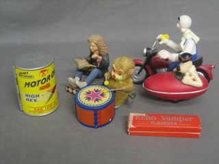 A Japanese tin plate figure of a drumming monkey, a Wallis & Grommet figure, a Harry Potter figure, a mouth organ and a Micro Machines garage in the form of a tin of oil