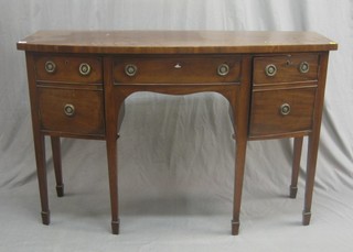 A Georgian mahogany bow front sideboard fitted 1 long drawer flanked by a pair of cupboards, raised on square tapering supports ending in spade feet 54"