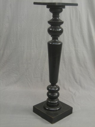 A Victorian turned and ebonised torchere
