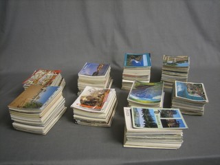 A large collection of various postcards