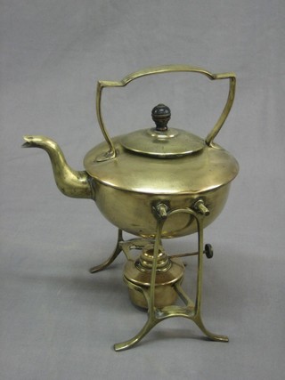 An Art Nouveau brass spirit kettle complete with burner