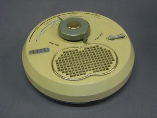 A 1960's circular Decca wall mounting radio model TPW 70 10"