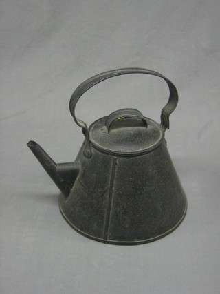 A circular waisted pressed metal kettle