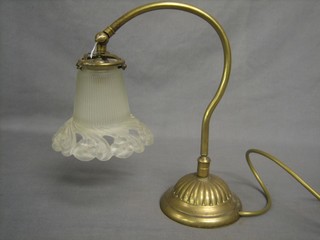 An Art Nouveau brass table lamp with reeded glass shade