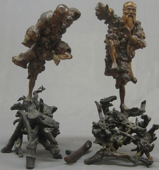 A pair of Eastern carved rootwood figures 15"