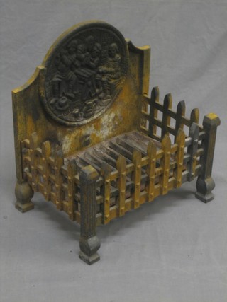 An iron fire grate incorporating a fire back 16"