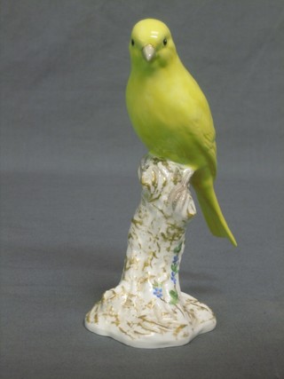 A Royal Worcester figure of a seated Canary, the base with black Worcester mark, marked 2665 6"