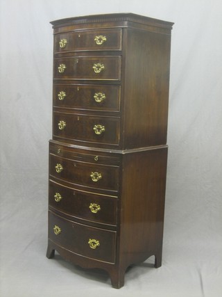 A Georgian style mahogany bow front chest on chest, the upper section with moulded and dentil cornice, fitted 4 long drawers, the base fitted a brushing slide above 3 long drawers, raised on bracket feet 24"