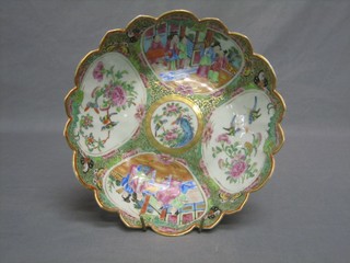 A circular Canton famille rose porcelain bowl with scallop edge and panel decoration depicting court figures 9 1/2"
