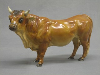 A brown glazed Continental porcelain figure of a standing bull 8"
