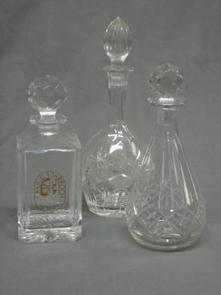 A spirit decanter and 2 cut glass decanters