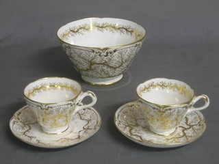 A 19th Century 24 piece tea service with gilt decoration comprising 7" slop bowl, 12 saucers (1 cracked, 2 chipped), 11 cups (3 chipped)