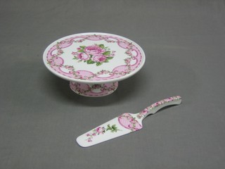 A circular floral patterned comport raised on a circular spreading base, complete with matching slice 10" 