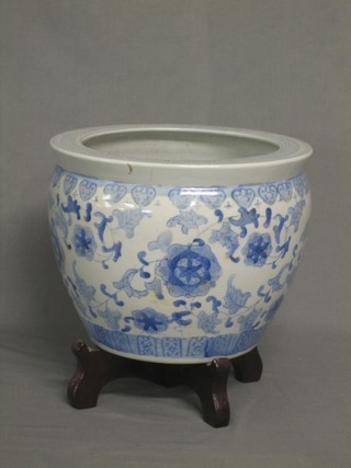 An Oriental style blue and white jardiniere 12" with wooden stand