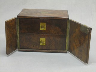 A Victorian figured walnut roll top "cigar" box fitted 2 long drawers and enclosed by a panelled door 12"