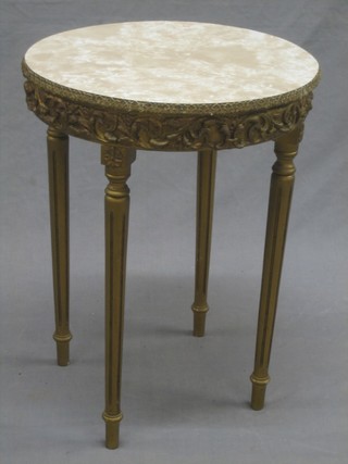 A circular gilt painted occasional table with faux marble top, raised on reeded supports 16"
