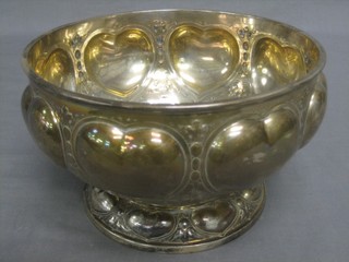 A circular embossed Sterling silver bowl, the base marked Sterling 227A, 26 ozs
