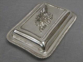 A rectangular silver plated entree dish and cover with gadrooned borders