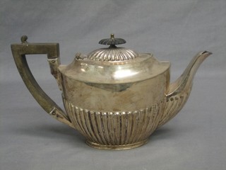 An oval silver plated teapot with demi-reeded decoration by James Dixon