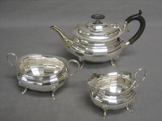 A silver plated 3 piece tea service comprising teapot, twin handled sugar bowl and cream jug
