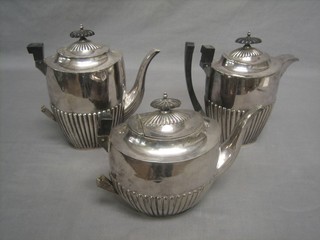 A Britannia metal 3 piece tea/coffee service by Walker & Hall comprising teapot, coffee pot and hotwater jug (handles f)