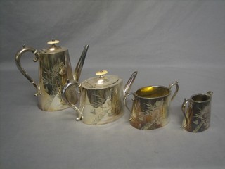 An engraved oval silver plated 4 piece tea/coffee service comprising teapot, twin handled sugar bowl, cream jug and coffee pot