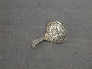 A George III silver caddy spoon with scallop shaped bowl Birmingham 1810
