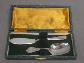 A Victorian silver caddy spoon, Birmingham 1869 and a silver butter knife