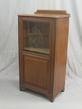 A Victorian walnut music cabinet enclosed by a glazed panelled door 22"