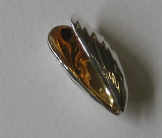 A Sterling silver mussel eater in the form of a mussel shell with gilt interior