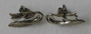 A pair of silver earrings in the form of Tulips